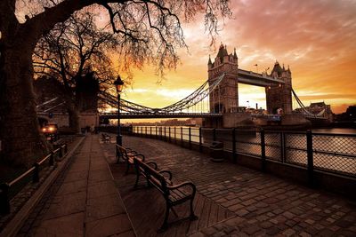 Bridge over river during sunset