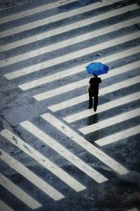 High angle view of person crossing road