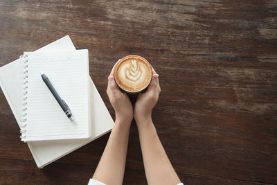 High angle view of coffee cup on table