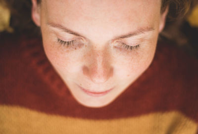 Close-up of smiling woman with eyes closed