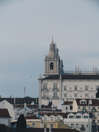 View of buildings in city against sky