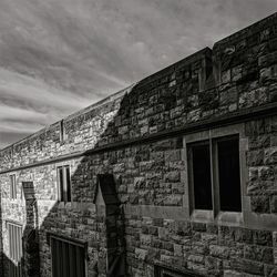 Low angle view of old building against sky