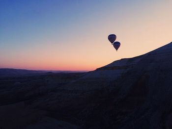 Hot air balloon over landscape