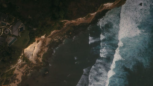 High angle view of rock formation on sea