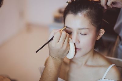 Portrait of woman holding hands