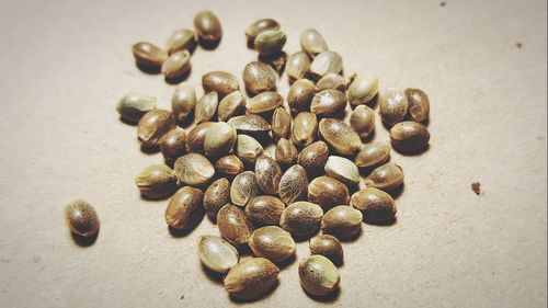 Close-up of roasted coffee beans on table