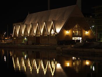 Reflection of illuminated buildings in water