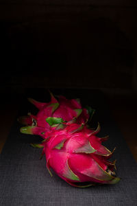 High angle view of pink rose on table