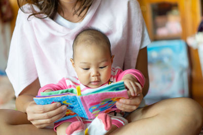 Close-up of mother holding baby girl