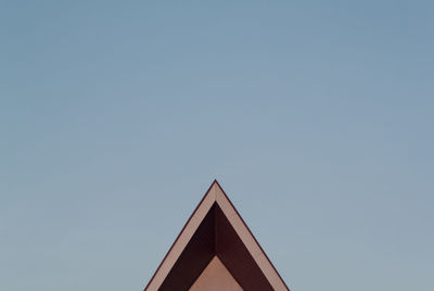 High section of building corner against clear blue sky