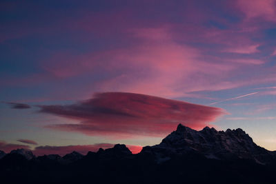 Low angle view of mountains against sky during sunset