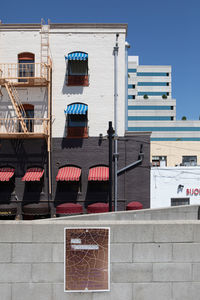 Low angle view of buildings against blue sky