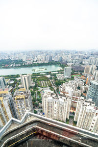 High angle view of buildings in city against sky