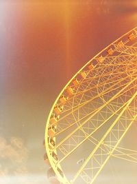 Low angle view of ferris wheel against sky