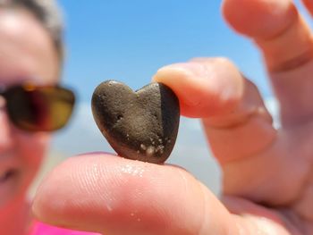 Close-up of person holding heart shape