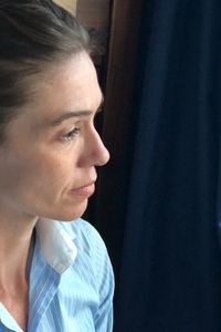Close-up portrait of young woman looking away