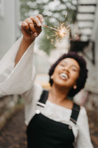 Midsection of a smiling young woman