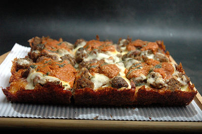 Close-up of detroit style pizza on wooden board