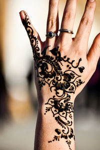 Close-up of woman hand with tattoo