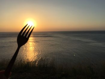 Scenic view of sea at sunset