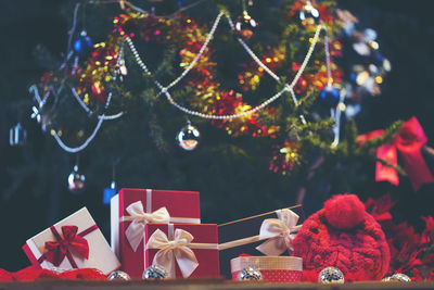 Close-up of presents against christmas tree