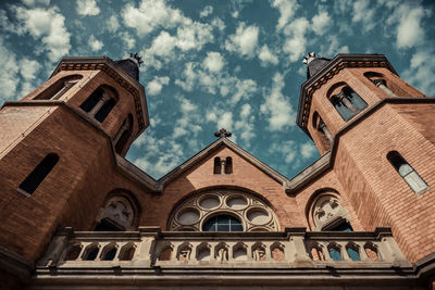 Low angle view of historic church against sky