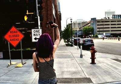 Rear view of woman on city street