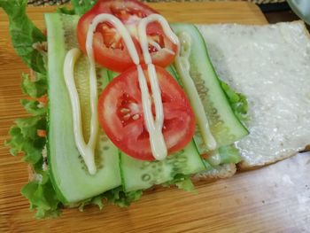 High angle view of chopped vegetables on cutting board