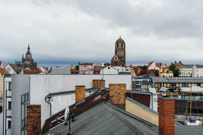 View of buildings against cloudy sky