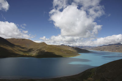 Scenic view of lake and mountains against sky