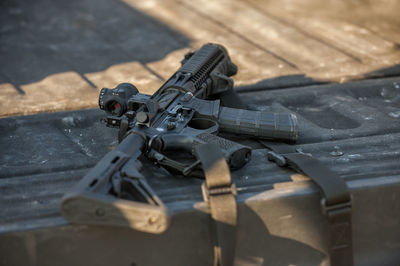 High angle view of sniper gun on footpath