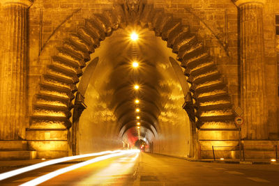 Man in illuminated tunnel