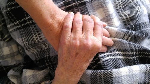 Cropped hands of mother and daughter