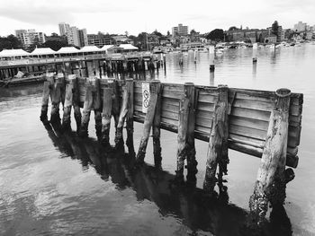 Pier on river against sky