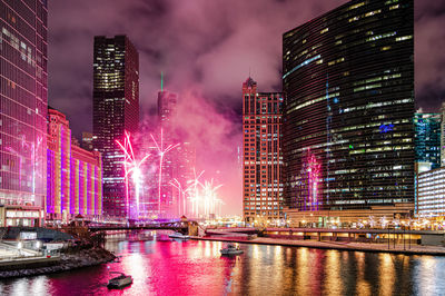 A beautiful display of fireworks near the chicago river at wolf point in chicago, usa