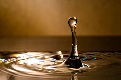 Close-up of drop splashing in water