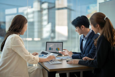 Business colleagues working in office