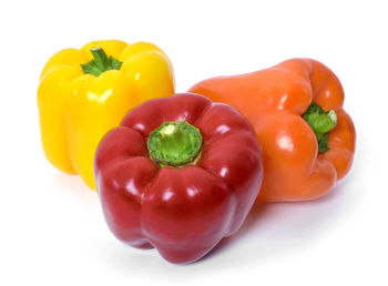 Close-up of bell peppers against white background