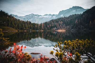 Scenic view of lake and mountains against sky