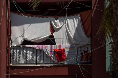 Curtains and sheet in balcony