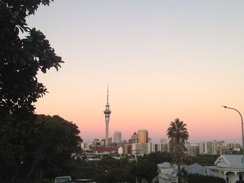 Buildings in city against clear sky