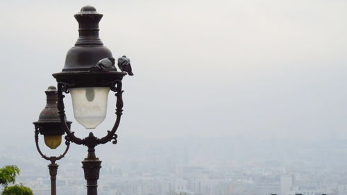 Lamp post against clear sky