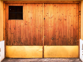 Closed wooden door of house