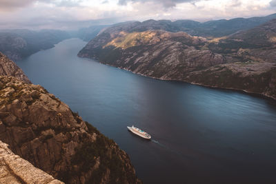 Top view of cruise ship cruising between the fjords in norway