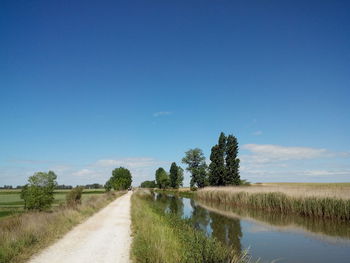 Scenic view of landscape against cloudy sky