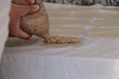 Close-up of man preparing food