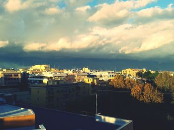 Townscape against cloudy sky