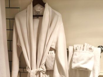 Bathrobe hanging in bathroom at home