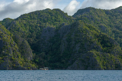 Photo showcases the stunningly rugged coastline of the philippines. a series of rocky outcroppings.