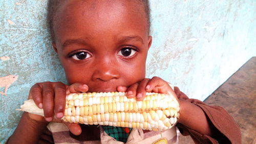 Close-up of girl eating corns